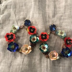 J. Crew Women’s colorful floral hoop earrings.